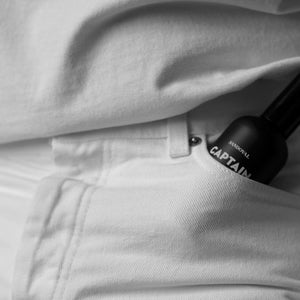 Our aromatic concentrate in the front pocket of someone's jeans. Tuck our natural aromatic fragrance spray into a pocket or bag for use as a natural hair perfume cologne on the go. 