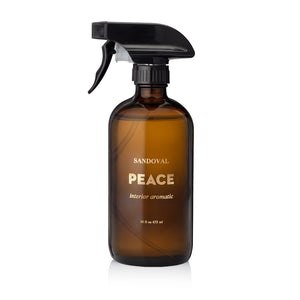 peace interior aromatic spray. natural aromatherapy room spray, linen spray, air freshener essential oil blend of patchouli essential oil, sandalwood essential oil, frankincense essential oil, palo santo essential oil. Housed in a black glass 16 ounce bottle. made in california. california fragrance.