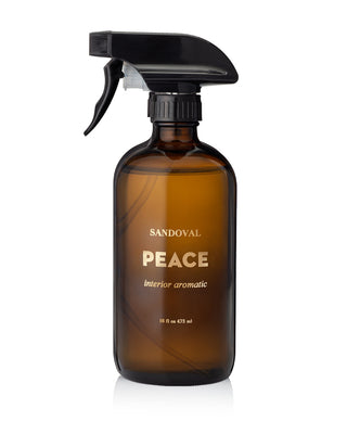 peace interior aromatic spray. natural aromatherapy room spray, linen spray, air freshener essential oil blend of patchouli essential oil, sandalwood essential oil, frankincense essential oil, palo santo essential oil. Housed in a black glass 16 ounce bottle. made in california. california fragrance.