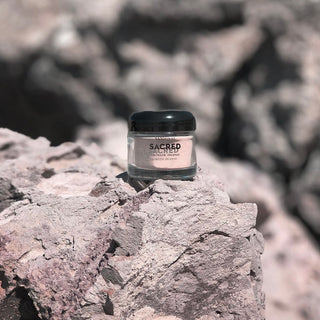 sacred aromatic incense powder of sandalwood and palo santo. 2 ounce glass jar with amethyst crystals. Shot on location in Malibu,California.